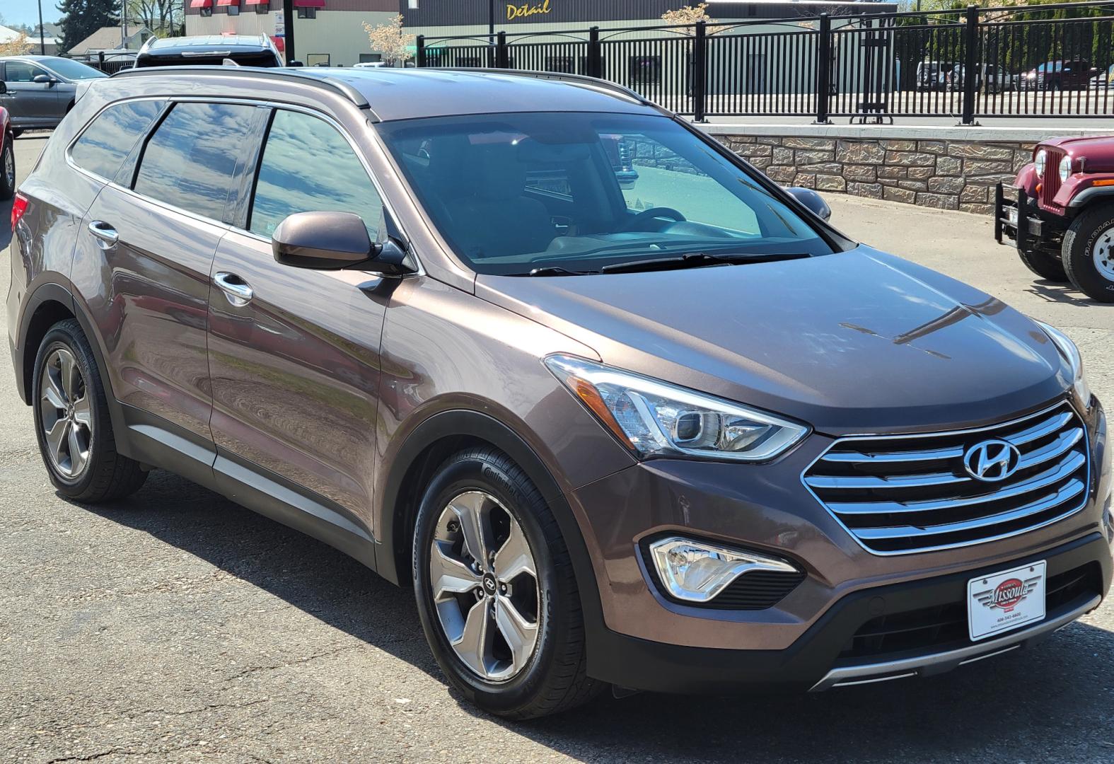 2015 Brown /Tan Hyundai Santa Fe GLS (KM8SMDHF7FU) with an 3.3L V6 engine, 6 Speed Auto transmission, located at 450 N Russell, Missoula, MT, 59801, (406) 543-6600, 46.874496, -114.017433 - Great Running AWD SUV. 3.3L V6 Engine. 6 Speed Automatic Transmission. 3rd Row Seating. Heated Front Seats. Power Drivers Seat. Backup Camera. AM FM XM CD. Bluetooth. Newer Continental Tires from Les Schwab. New Brakes. Air. Cruise. Tilt. Power Windows and Locks. - Photo#2